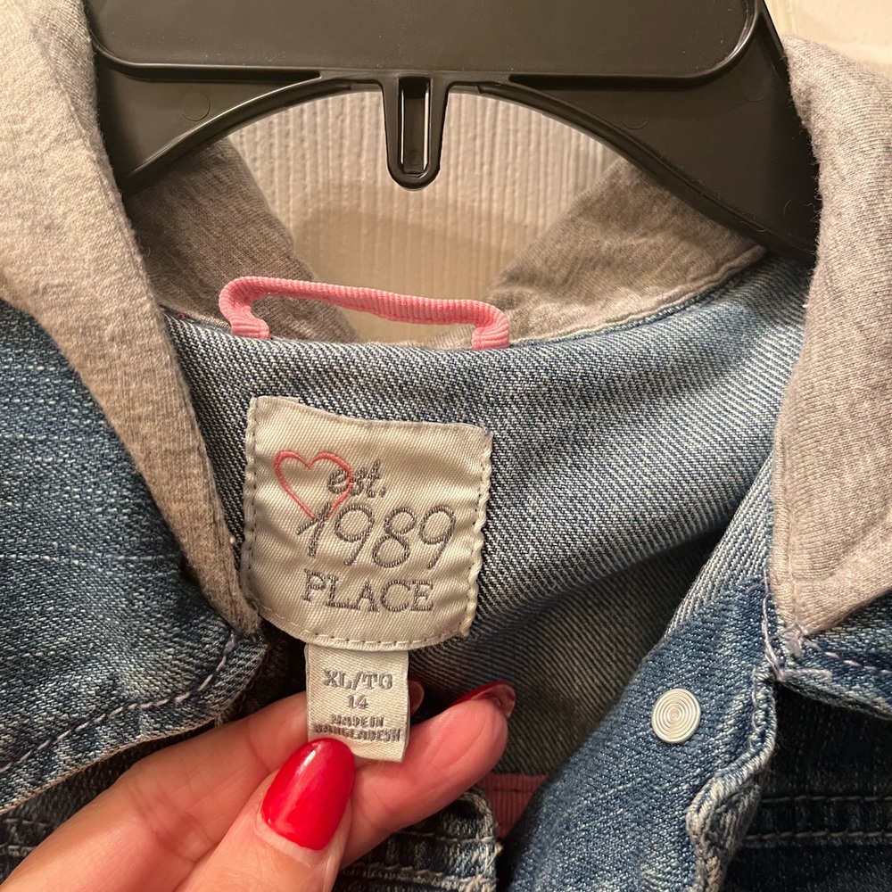 The Children’s Place girls hooded jean vest. Size 14 and worn only once.